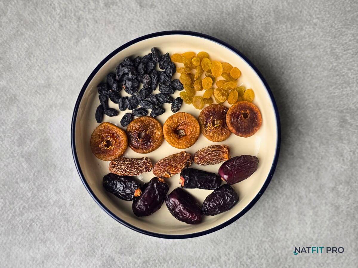 A collection of dried fruits including dates and raisins, a concentrated source of calories and carbs for bulking.