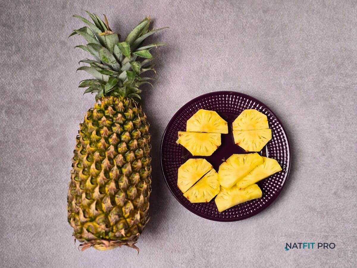 A whole fresh pineapple, a tropical fruit that contains bromelain to aid digestion and recovery.