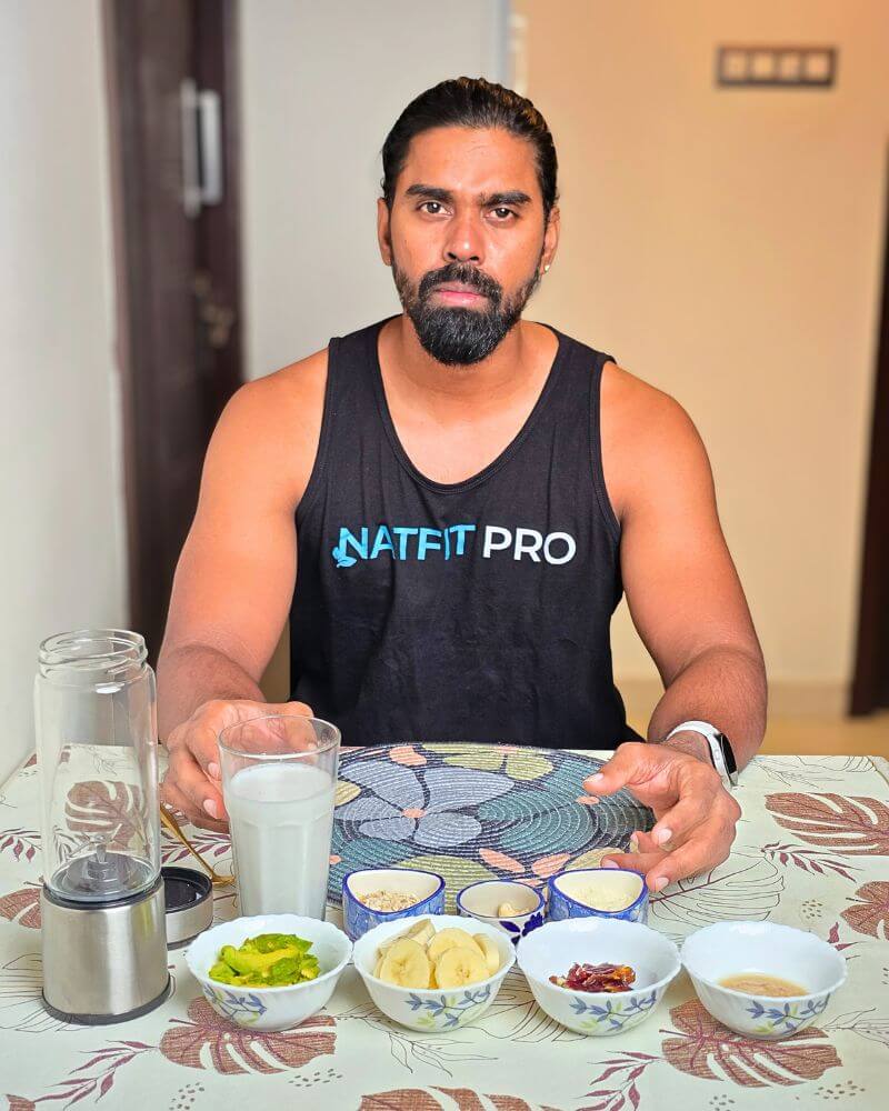 Tamil Arasan of Natfit Pro with all the ingredients for his 1000+ calorie weight-gain shake, including banana, avocado, and dates.