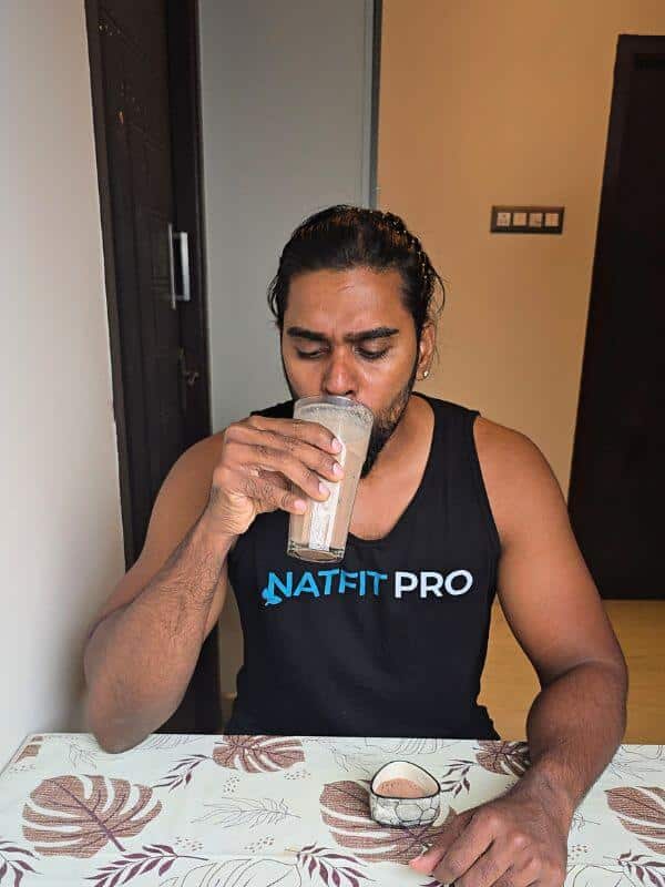 Tamil Arasan of Natfit Pro drinking his personal high-calorie, post-workout muscle-gain shake.
